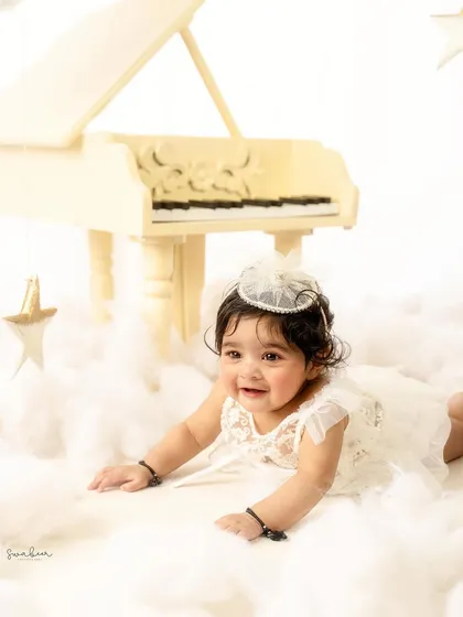 A happy crawl through the "clouds." This dynamic shot shows off the baby's mobility and joyful spirit.
