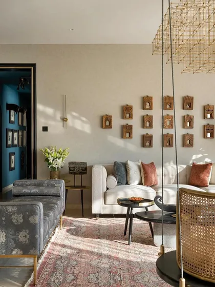 The living area of the AD-featured home, showing a variety of our custom pieces, including a daybed and a traditional Indian swing, creating a collected and personal feel.