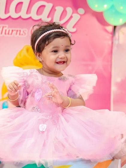 A thrilling 'PJ Masks' themed birthday party, with character cutouts, a cityscape backdrop, and blue and green balloons, ready for a night of adventure.