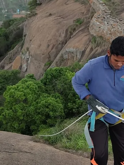 Our guide setting up the ropes for a rappelling session at Uttari Betta. Safety is always our first priority.