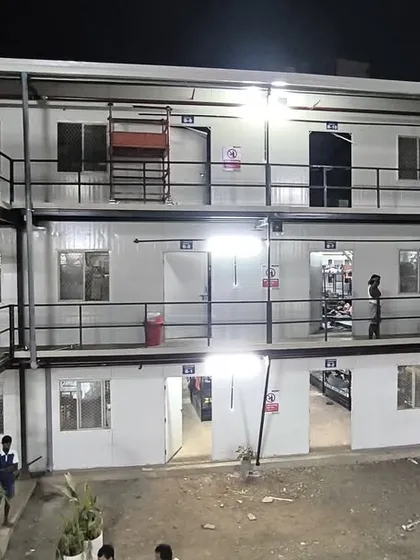 This closer view of the completed labor colony highlights the modular design, external staircases, and individual units. Our prefabricated solutions provide safe and comfortable accommodation.
