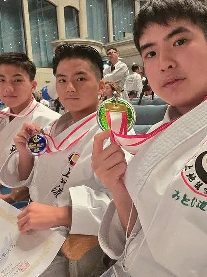 Our students proudly displaying their medals at the Okinawa tournament. Competing and winning at the birthplace of karate is an incredible achievement.