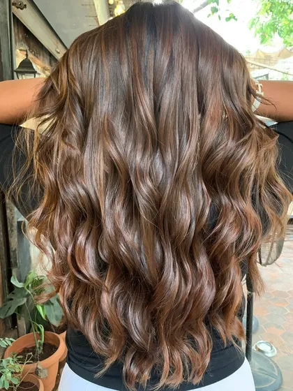 I call this shade 'Betel Nut'. It's a glossy, warm brown that's perfect for summer, created without bleach to keep the hair super healthy.