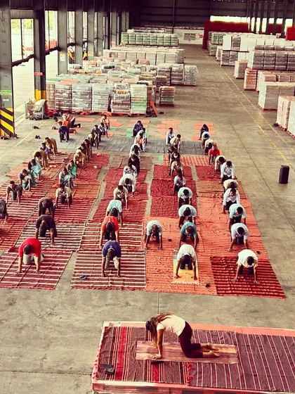 Yoga is for everyone, everywhere. Here I am leading a corporate yoga session for the employees at a Coca-Cola warehouse, guiding them through foundational poses to bring wellness and mindfulness into their workday.