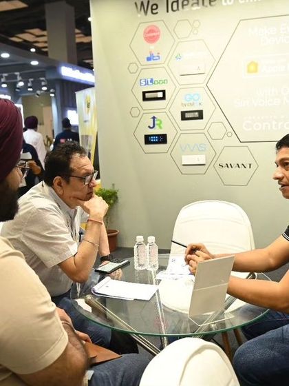 Our team discussing the technical details of our in-house developed Control4 drivers with an industry partner. These collaborations are key to our innovation.