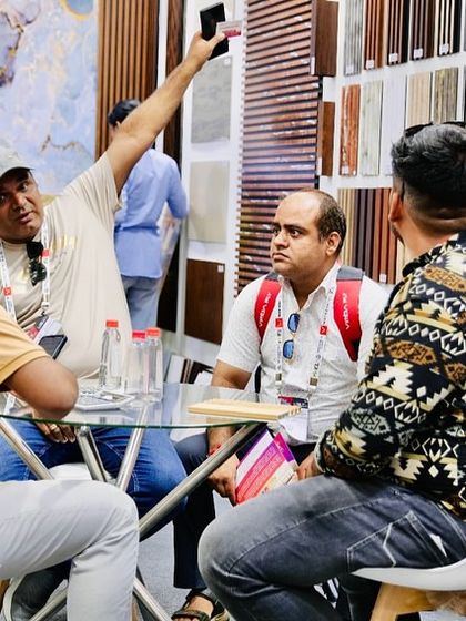 A group of architects and designers discussing a project at our stall, using our displays as a reference.