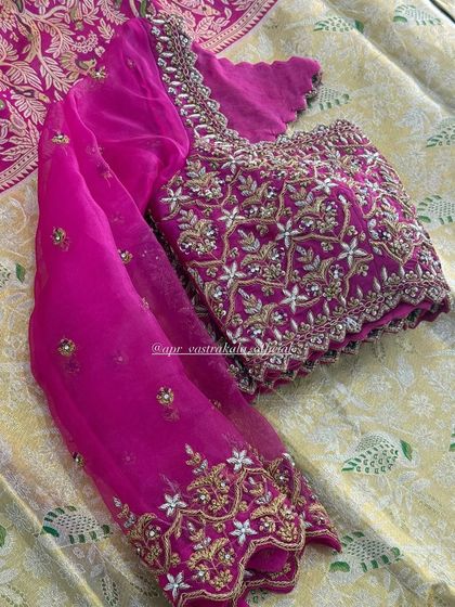 The full view of the pink floral blouse, showing the sheer sleeves.