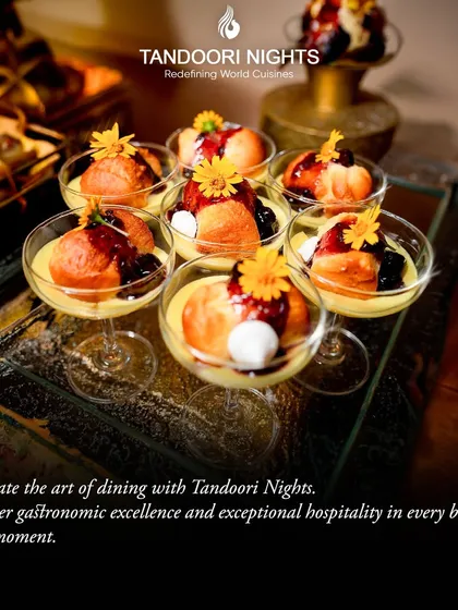 Celebrate the art of dining with us. These individual dessert glasses, featuring a creamy panna cotta with a rich berry coulis and edible flowers, showcase our commitment to gastronomic excellence.