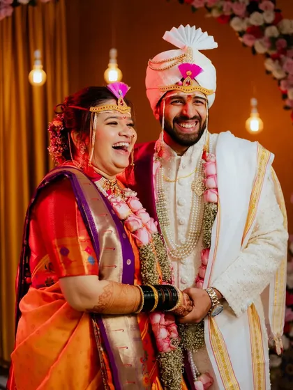 The best moments are the ones filled with laughter. Mrunal and Prachiti share a candid, happy moment during their Marathi wedding ceremony.