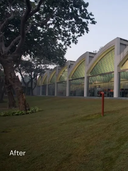 Another 'after' shot of the adaptive reuse project in Okhla, highlighting the series of arched glass facades that replaced the old brick walls. This design floods the interior with natural light.