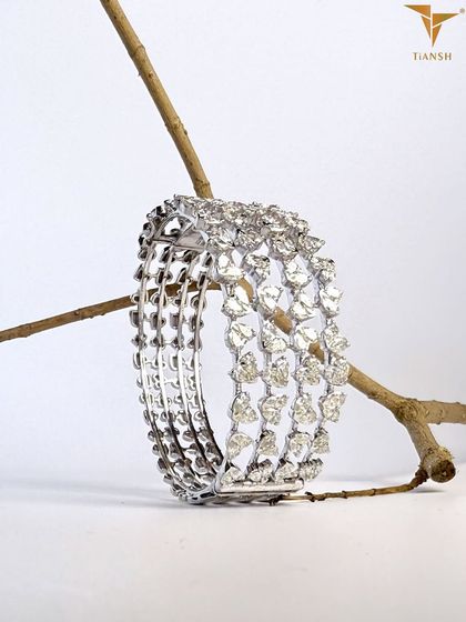 Meticulously crafted, this multi-row diamond bracelet showcases expert workmanship. Each diamond is set with precision, highlighting the quality and attention to detail in every curve.