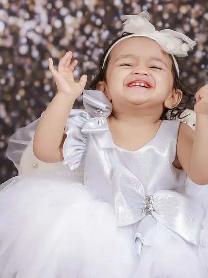 Pure, uncontainable laughter. This close-up is all about capturing the happiness and vibrant energy of your child during their fun-filled photoshoot.