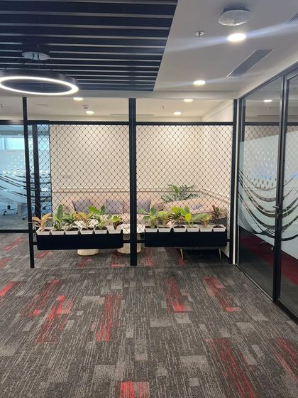 Our designs can also serve as functional space dividers. These planters are integrated into a partition, offering a green and semi-transparent barrier that maintains an open feel while defining separate zones.
