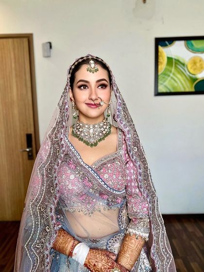 Another portrait of the bride, capturing the elegance of her complete wedding day look.