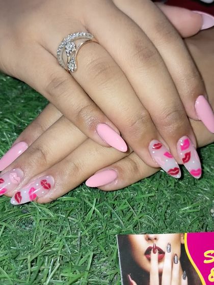 Another view of the fun and flirty lipstick kiss nail art.