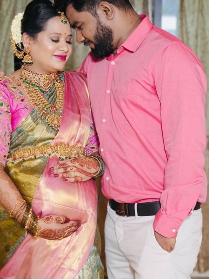 A lovely photo from a client's baby shower. She is wearing a classic temple jewellery set that perfectly complements her beautiful pink and green saree.