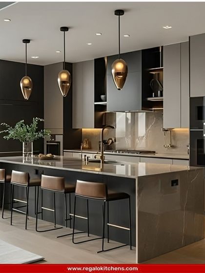 This two-tone island kitchen exudes modern sophistication with its matte black and grey cabinetry. The island serves as a central hub with integrated seating, complemented by unique pendant lighting that adds an artistic touch.