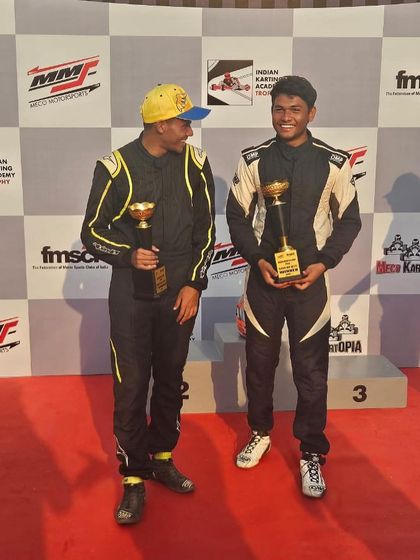 Teammates celebrating on the podium.