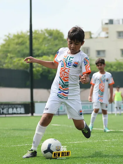 Focused on the ball. A player demonstrates excellent technique and concentration during a practice match, key attributes we nurture in our athletes.