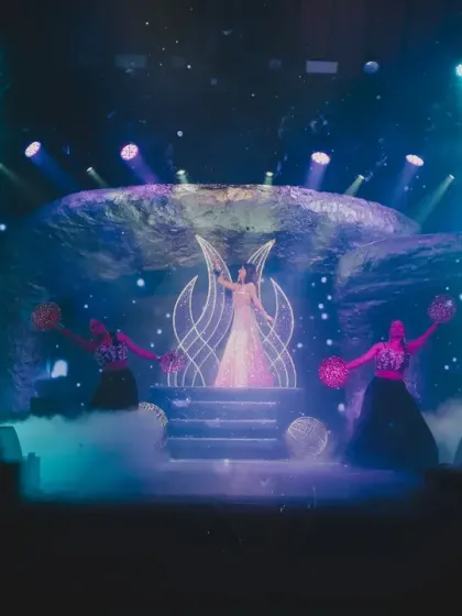 The bride's solo performance to open the Sangeet. We designed a celestial stage with cosmic backdrops and professional dancers to make her moment feel powerful and otherworldly.