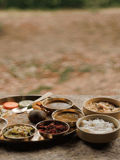 A simple, wholesome meal at a rustic organic farm stay near Bangalore. The food here is prepared using locally grown ingredients, offering a true farm-to-table experience that is both delicious and deeply connected to the surrounding nature.