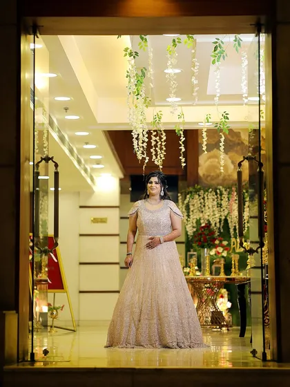 A grand entrance shot of the bride in her stunning engagement gown. This photo captures her elegance and the beauty of her attire.