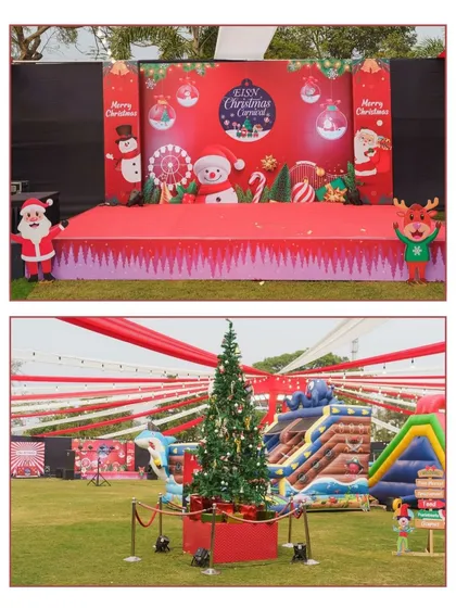 Here's a look at our Christmas carnival setup, featuring a festive stage backdrop with snowmen and a large, beautifully decorated Christmas tree as the focal point on the grounds.