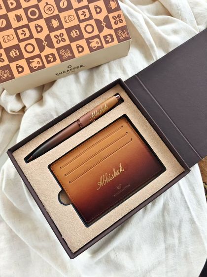 Personalization is the new definition of premium. This Sheaffer pen and cardholder gift set was made truly unique with the recipient's name elegantly calligraphed in gold.