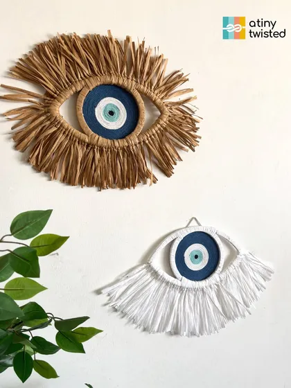 Here are two of my most popular Evil Eye designs, side-by-side. One is crafted with natural raffia for an earthy, rustic feel, while the other uses soft white cotton for a clean, modern look. Both are made to bring a sense of peace and protection to your space.