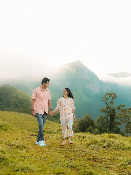 A walk through the misty hills near Sakleshpur, with the mountains creating a breathtaking backdrop. I love using natural weather conditions like fog to add a dreamy, cinematic quality to your couple portraits.