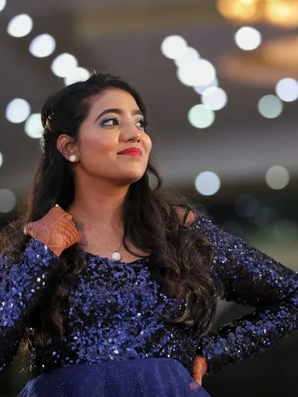 Reception glam is all about fun and sparkle. For this look, I focused on a shimmery eye and a bold lip to match her stunning sequined gown, creating a perfect modern makeup look for her evening celebration.