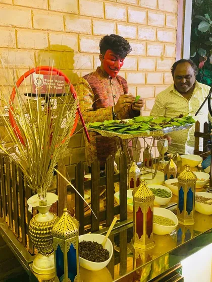 My paan station is not just about the taste, it's about the experience. My server, dressed for the occasion, skillfully prepares fresh paan for guests from a counter filled with a variety of ingredients.
