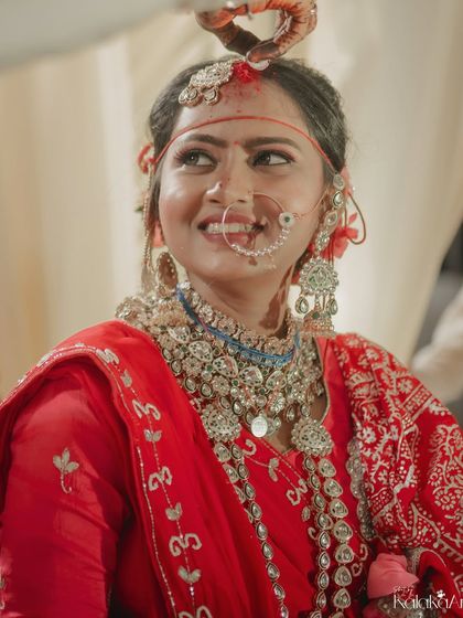 A candid shot of the bride during her wedding ceremony, her happy expression captured in a moment of joy.