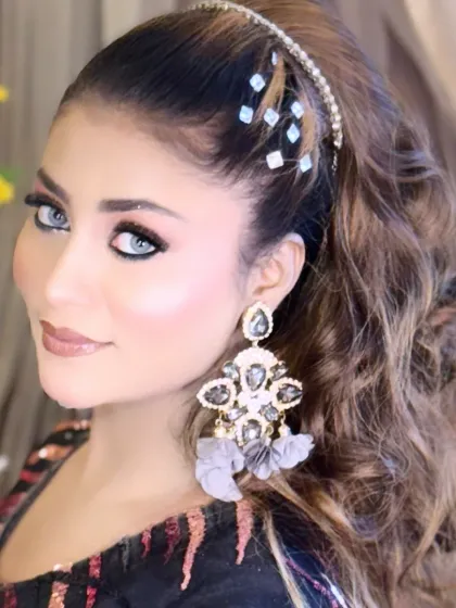 Another close-up portrait from a creative shoot, highlighting the flawless base and eye-catching makeup.
