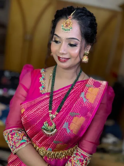 A close-up of Sona's makeup, showing the shimmery gold eyeshadow and the pretty pink lip.
