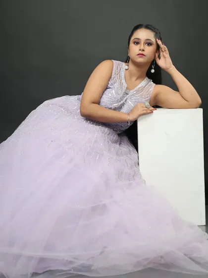 Another beautiful shot of the lavender gown, showing how it drapes elegantly even when seated.