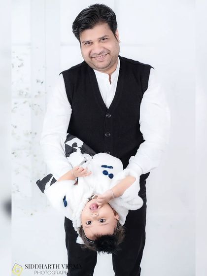 A playful, upside-down moment between a father and his daughter. This candid shot is full of laughter and shows the fun side of family photoshoots.