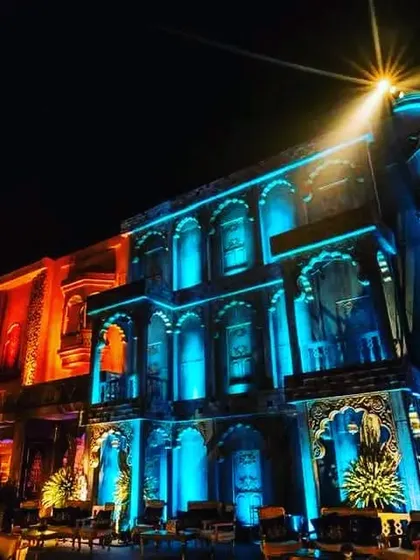 Another angle of the projection-mapped palace, here illuminated in a cool blue light. This demonstrates the versatility of using lighting to create different moods throughout an event.