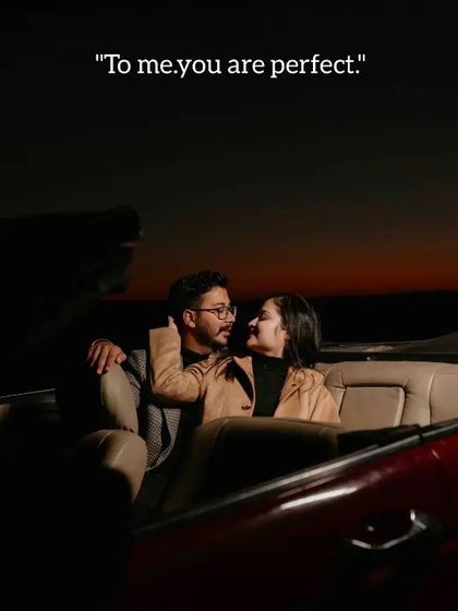 An intimate moment inside the convertible at sunset, with the warm light creating a romantic and cozy atmosphere.