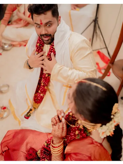 The look of pure surprise! Capturing the groom's priceless and goofy reaction during Anushka and Harsh's home wedding was a highlight. These are the authentic, un-posed memories that you'll cherish forever.