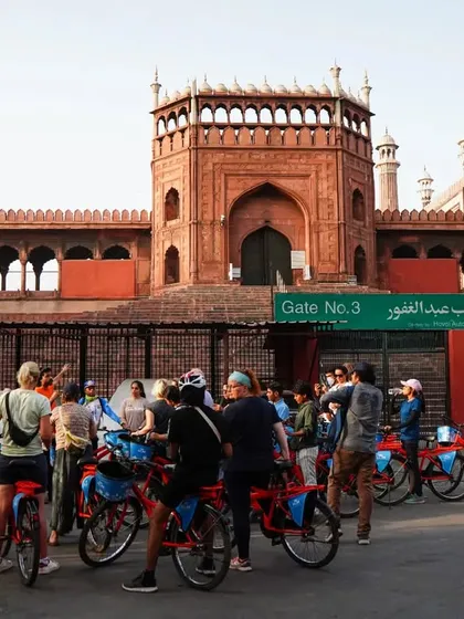Pausing to admire the grandeur of Jama Masjid. This architectural marvel is a key stop on our Old Delhi tours, offering a moment of peace amidst the city's hustle.