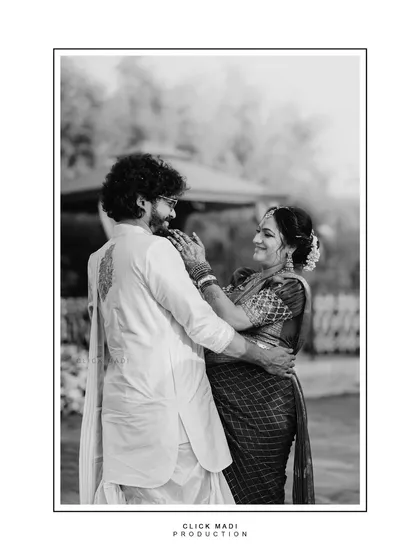 A candid, black and white photograph capturing a spontaneous, loving moment between the couple. I believe these unposed interactions tell the most beautiful stories, creating timeless memories that you will cherish forever.