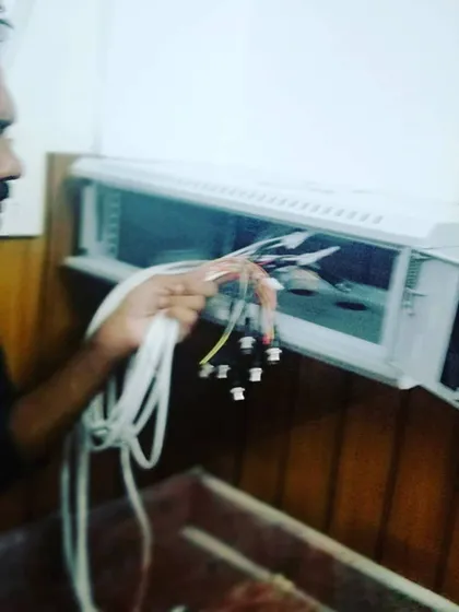 The details matter in a security installation. Here, I am carefully organizing and connecting the cables for a new DVR system to ensure a stable and long-lasting connection for every camera.