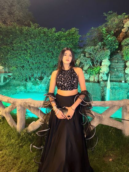 A confident pose in the full lehenga, ready for a wedding function.