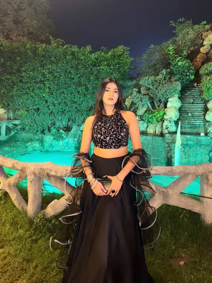 A confident pose in the full lehenga, ready for a wedding function.