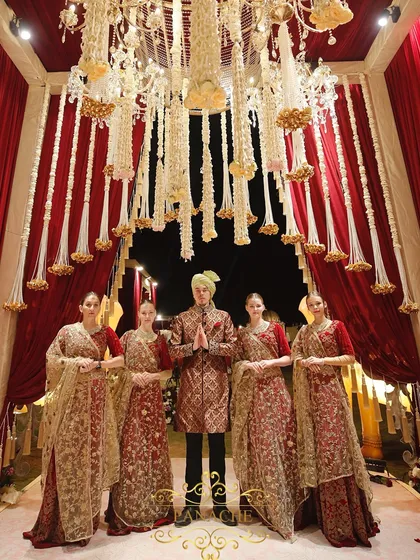 Our hospitality team, dressed in theme-coordinated attire, ready to welcome guests. We believe the guest experience is paramount, and every detail, including staff presentation, is meticulously planned.