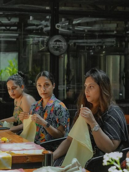 Participants at a workshop, fully engaged in preparing their fabrics for dyeing. I love the focused, creative energy that fills the room during these sessions.