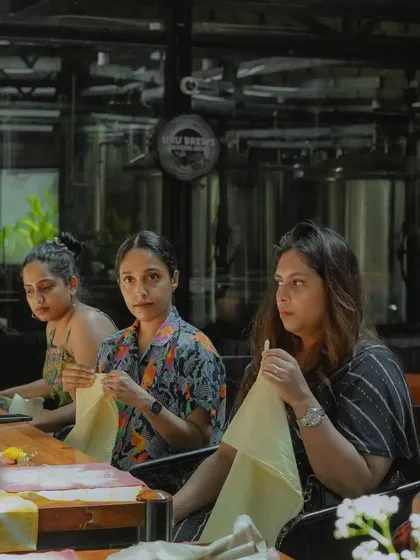 Participants at a workshop, fully engaged in preparing their fabrics for dyeing. I love the focused, creative energy that fills the room during these sessions.