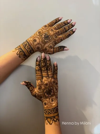 A different view of the elephant-themed design, showing how the patterns connect and flow when the hands are placed together.