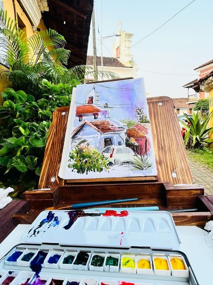 My easel set up in the colorful streets of Fontainhas, Goa's Latin Quarter. The light and architecture here are a painter's dream.